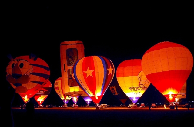 Hot air balloons landing in the evening during the 2010 Hot Air Balloon Fiesta in Clark, Pampanga. 