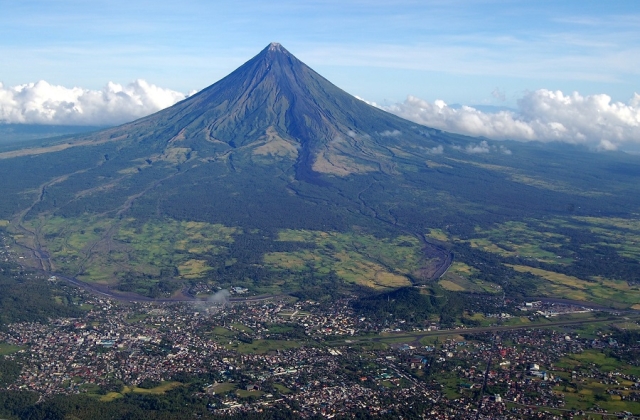 During peaceful times, Mount Mayon draws many hikers who enjoy the challenge of summiting the cone-shaped volcano. 