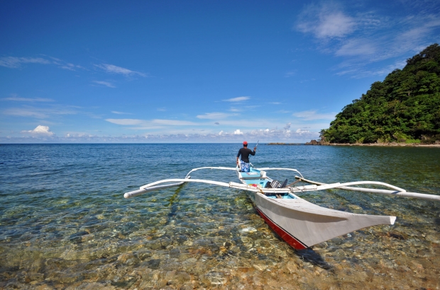 Small outrigger boat for beach hopping